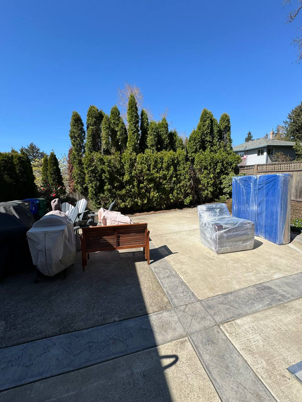 Movers protecting furniture with blankets